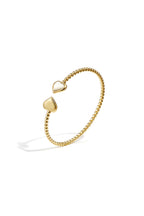 Bracciale a pois simmetrici con estremità decorate.