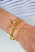 Bracciale con doppia catena e piccolo fiore
