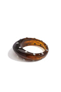 Bracciale rigido in resina con borchie