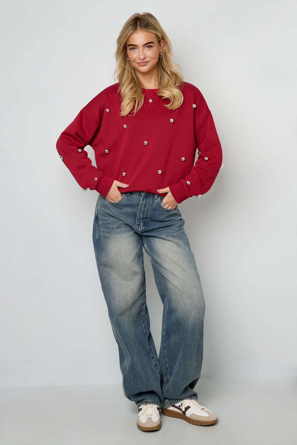 Maglione con borchie