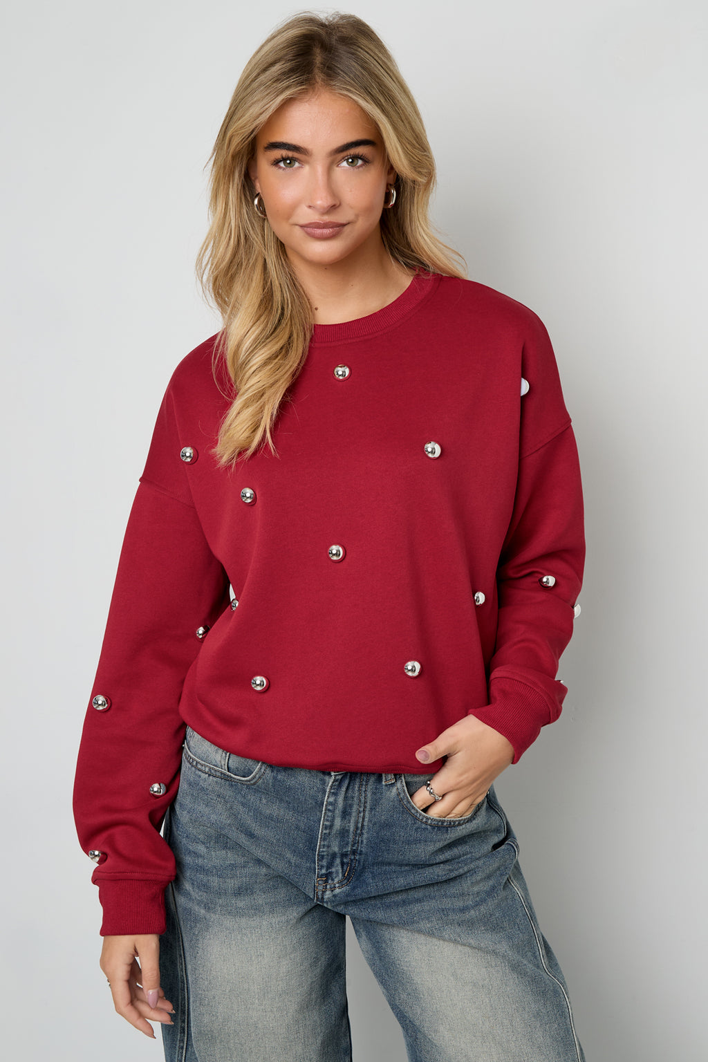 Maglione con borchie