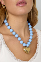 Collana di perline con cuore pendente