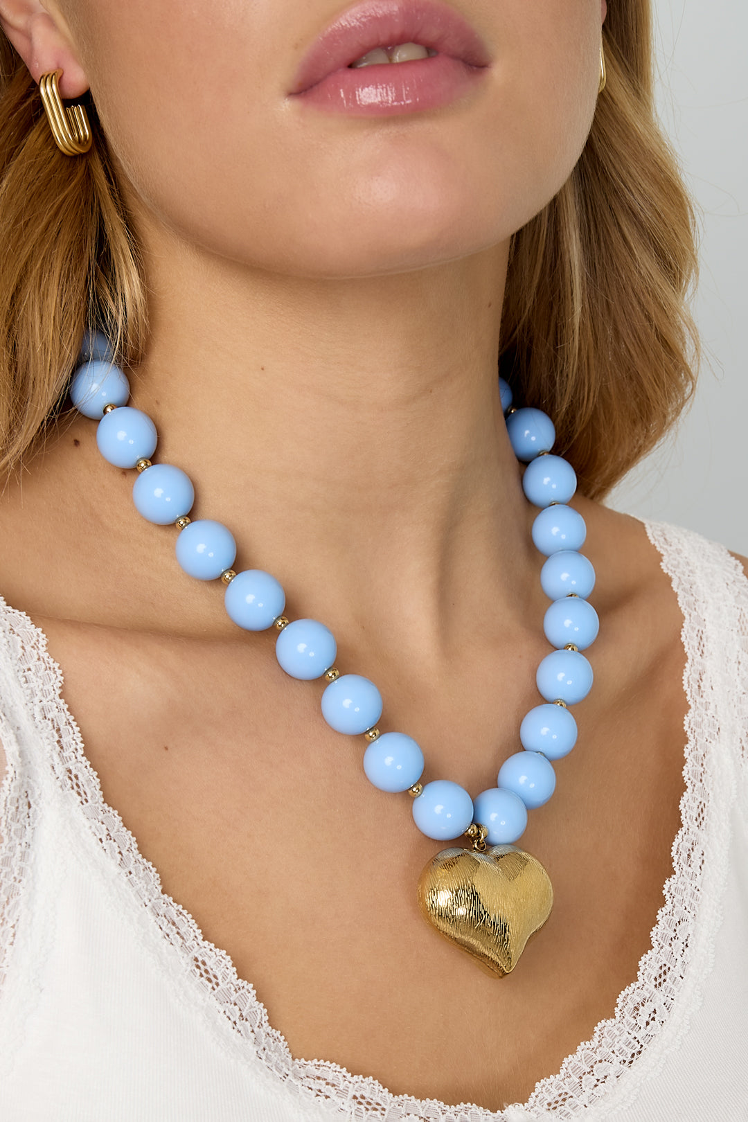 Collana di perline con cuore pendente
