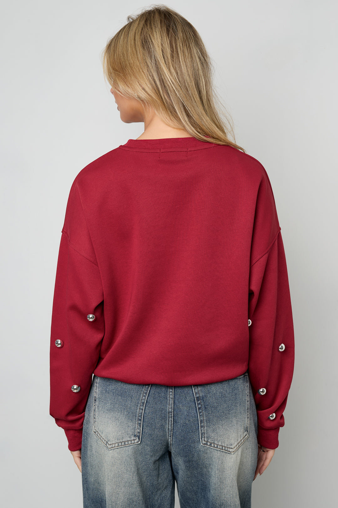 Maglione con borchie