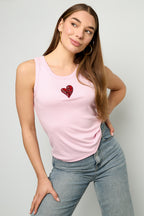 Top con cuore lucido