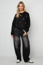 Maglione con borchie