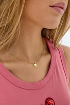 collana con palline e ciondolo a cuore