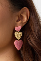 Orecchini vistosi con cuori glitterati