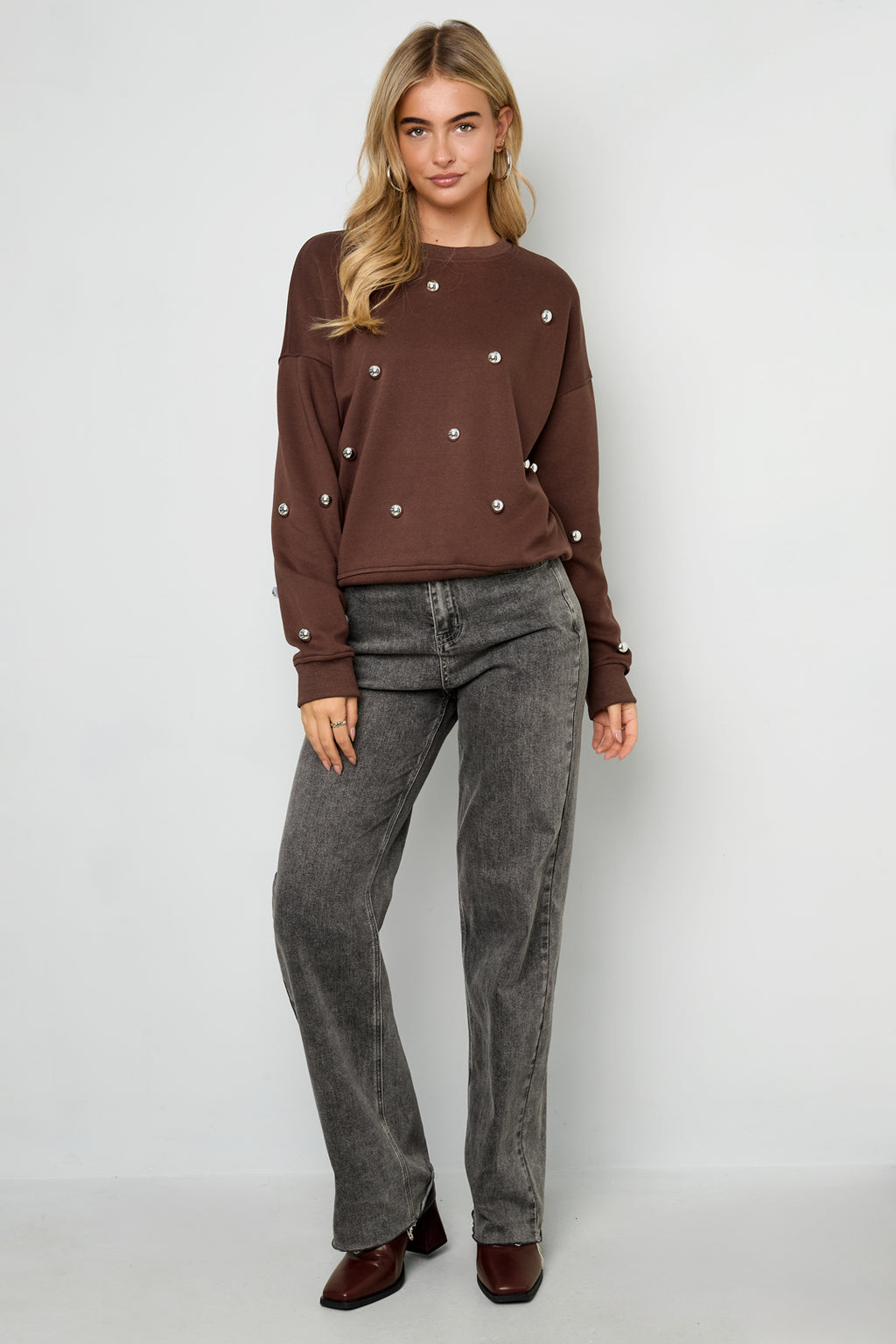 Maglione con borchie
