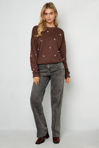 Maglione con borchie