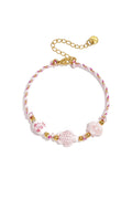 Bracciale con perline a forma di tartaruga e conchiglia e motivo a corda