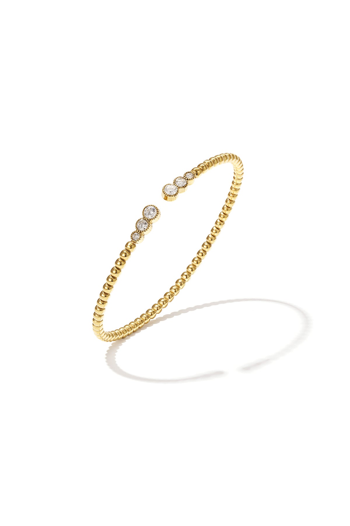 Bracciale a pois simmetrici con estremità decorate.