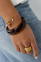 Bracciale a maglie con perle e ciondoli a forma di cuore