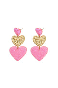 Orecchini vistosi con cuori glitterati