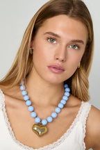 Collana di perline con cuore pendente