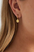 Orecchini con monete Muse