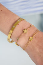 Bracciale con motivo alternato di fiori e pietre