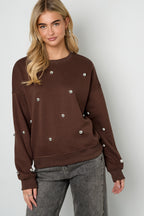 Maglione con borchie