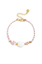 Bracciale a corda con perline a forma di conchiglia e di fiori